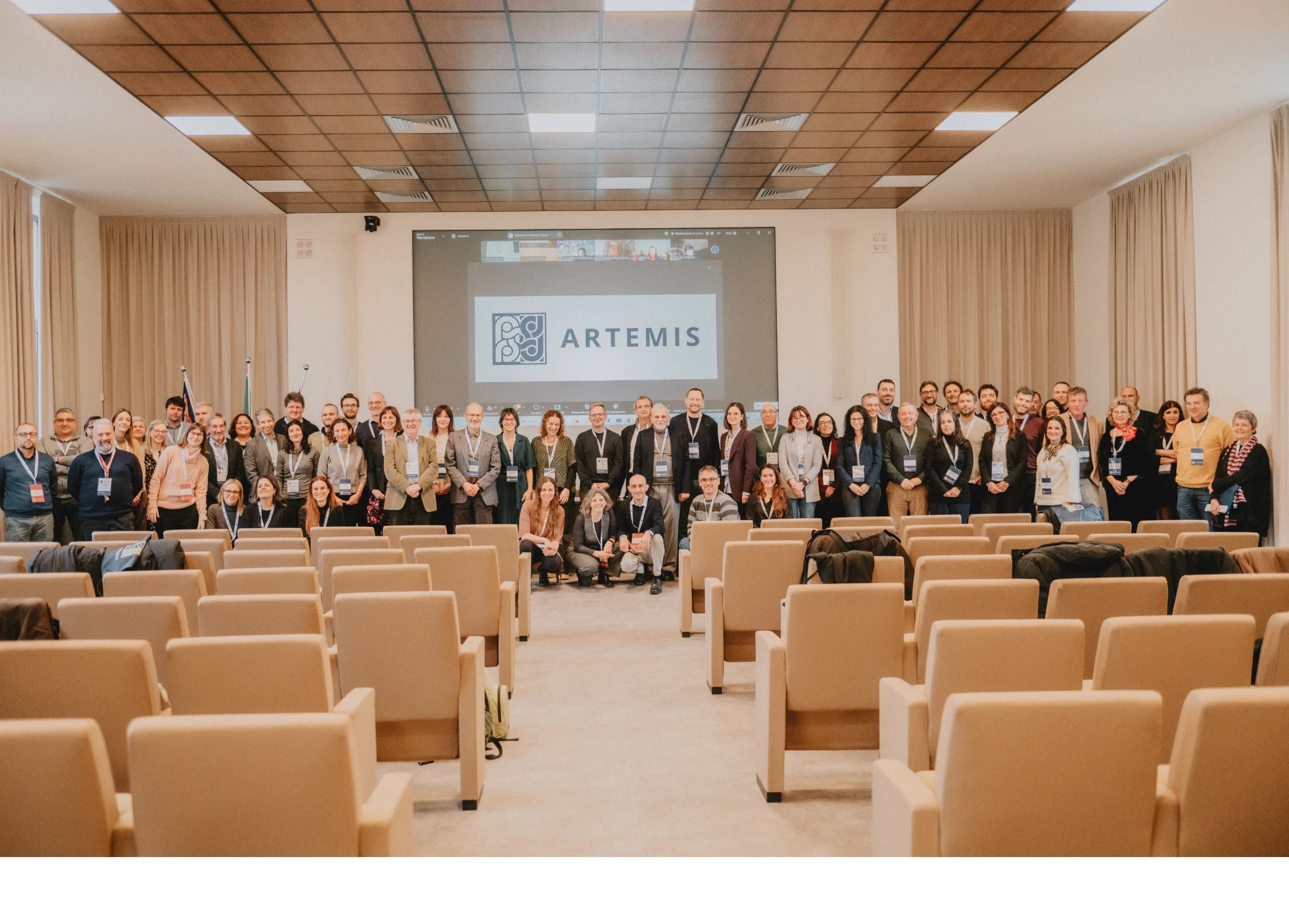 Group photo with over 60 people in a seminar room