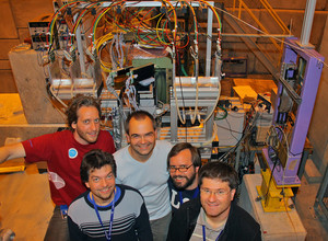 HEPHY members performing a beam test at CERN. Several detector modules are visible in the background, including an Origami module.