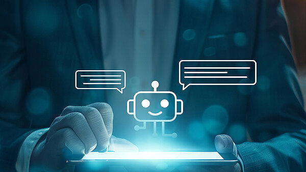 Die grafische Illustration zeigt einen Mann, der ein Tablet in der Hand hält. Oberhalb des Tablets ist ein symbolhafte Roboter zu sehen, der Sprechblasen von sich gibt.