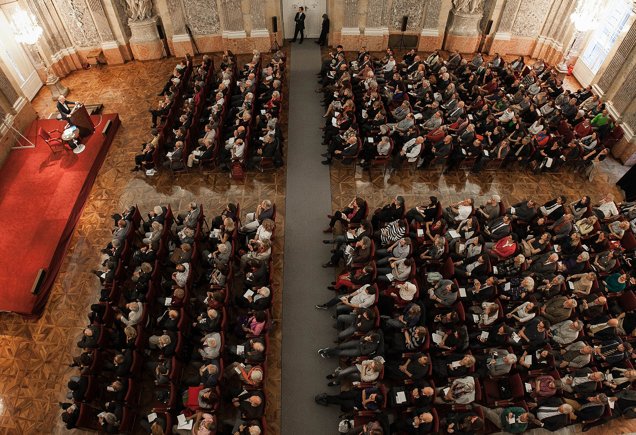The Academy's festive hall, photographed from above. The seats are filled.