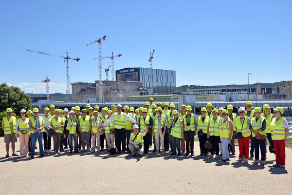 a group of visitors on the grounds of ITER